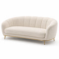 Canapé 3 places en tissu bouclé beige avec pieds en métal doré